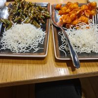 Green beans in sweet soy sauce and sesame. And buffalo cauliflower. Both with fried rice noodles and Both the small (70%) meal size. at Gan Bei in Riga