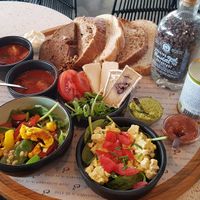 Vegan lunch for two with soup, a shake, a salad, tofu egg salad, and bread with some spreads and things to put on it at Anne&Max in Apeldoorn