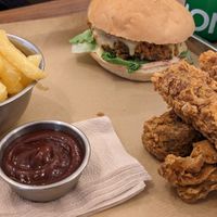 Burger, tenders, fries and BBQ sauce at Jimmy's Street Food in Paris