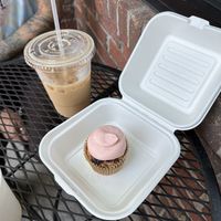 Iced oat vanilla cardamom latte and strawberry cupcake  at Dulce Vegan Bakery and Cafe in Atlanta