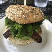Kale, Avocado + Tempeh Bacon on an Everything Bagel at Dulce Vegan Bakery and Cafe in Atlanta