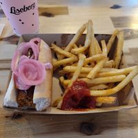 Vegan sausage with BBQ-sauce and pickled onion. The chips were nice at Korvhallen in Gothenburg