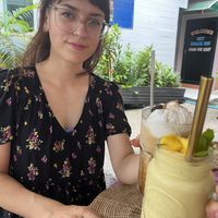 My gorgeous wife with our iced coffee and smoothie.  at Soul Phuket in Phuket