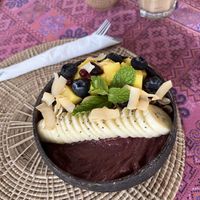 Açaí bowl with fresh mango, blueberries, shaved coconut, mint, and sliced banana.  at Soul Phuket in Phuket