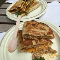 Spicy quesadilla and scrambled tofu with cheese in a naan bread  at Caked Coffee in Toronto
