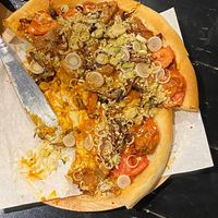Tom yum pizza (were really hungry so took photo after biting into it!) at Plant-erian in Krabi