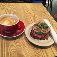 Almond milk latte and avocado toast at News Bar Cafe in New York City