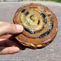 Savory pastry perfection: cheese, pesto, olives, sunflower seeds at Saint-Jean in Amsterdam