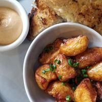 Vegan grilled cheese and smashed potatoes at Earthen  in Brooklyn