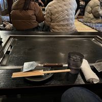 Seating on floor on tatami mats. Griddle to keep food warm while you eatt  at Gion Tanto - 祇園たんと in Kyoto