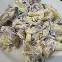 Vegan potato salad (labelled as being made with vegan mayo)  at Red Coat Cafe in Edinburgh