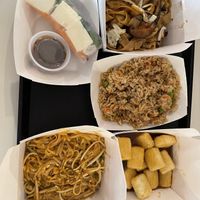 Fresh tofu roll, shiitake wide noodles, side vegan fried rice, orange tofu, vegan pad Thai    at Stiks in Sarasota