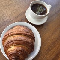Plain croissant and Americano   at Lazy Cow Bakery in Seattle