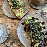 Oat milk cappuccinos with avocado toasts  at Honest Greens - Tuset in Barcelona