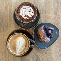 Oat latte, hot chocolate, berry cinnamon bun  at Fika in Bournemouth