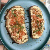 Hummus toast tomato basil  at Dushi Delicious  in Oranjestad