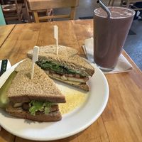 Roasted Tofu Sandwich + Cherry Garcia smoothie w/ chocolate protein powder (tofu is PERFECTLY marinated & smoothie is awesome - not too sweet)  at Wild Chestnut Cafe in Florence