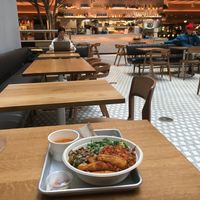 Vegan bowl, with view of food court at Teranga - Midtown in New York City