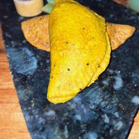 Empanada with 3 different kinds of tomatoes and empanada with “Vegallina"   at Salvajes in Cusco