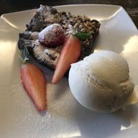 Chocolate brownie and ice cream (vegan)  at Cafe Roya in Beeston