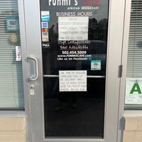 front door with sign indicating no dine-in at Funmi's Cafe in Louisville