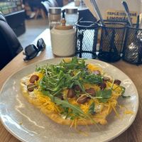 Langosz with cheese, sausage, and cream at Mamafood in Prague