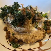 Celeriac steak with roasted chickpea hummus and crispy kale  at The Bear Hotel in Cowbridge