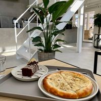 Cream mushroom pizza and a lemon chocolate cake at Cafe Planet in Kyoto
