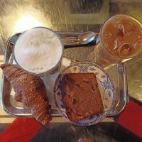 Croissant, banana bread, matcha and iced latte at Leopold in Brussels