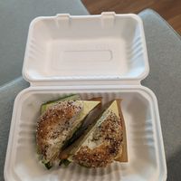 Bagel sandwich with veggies, avocado, hummus, vegan cheese, and vegan lunch meat (so good!!) 🤤 at LaRayia's Bodega in Atlanta