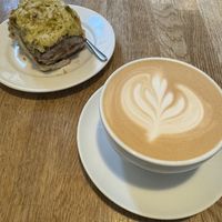 Oat latte and pistachio cinnamon bun  at Ministerstwo Kawy in Warsaw