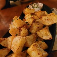Patatas bravas. Could have been crispier, but nice. Came with a good garlic mayo and very spicy tomato sauce. at Ziryab in Barcelona