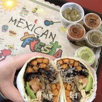 Yum! All the salsa 😝 there are sweet potato fries in the burrito btw. Very filling  at Mario's Taco & Burger House in Houston