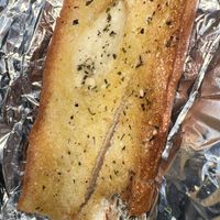 Garlic bread that come with pasta  at Razzi's Pizzeria - Greenwood Ave in Seattle