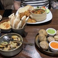 Chickpea stew, hummus with pitta bread, Greek beans, Canarian papas arrugadas and mushrooms al ajillo. All of this was £42.   at The Old Yard Tapas Bar in Darlington
