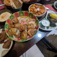 Chilli, vegan chorizo and honey potato skins (big bowl), hummus and pitta, Gigantes (tomato lima beans - really nice!), and Dolmades (stuffed vine leaves - also great!) at The Old Yard Tapas Bar in Darlington