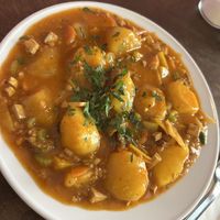 Karfiol Cremesuppe and Erdäpfelgulasch mit Vratwurst 14,50€  at Naturlich Wrenkh in Vienna