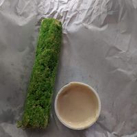 Date roll with sauce. Tasted ok. at The Hummusapiens in Berlin