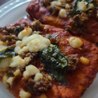 Vegan Fennel Sausage pizza with basil at Emma Hearth & Market in Bridgman