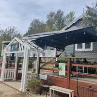 Entrance of Myrtle and Stone cafe, with the white fenced veranda at Myrtle and Stone in Wollombi