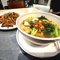 Yellow noodle with vegetarian wonton in mild soup. Stir-fried spicy spaghetti with Thai basil. at Talalaks  in Bangkok