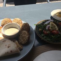 Part of vegetarian mezze (made vegan) : falafel, salad, hummus at Mezze in Lisbon