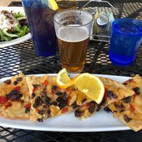 Hummus pizza. Costs extra $ to make vegan because of the gluten free crust even though they remove the feta at Secret Garden Cafe in Sedona