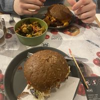Huxler burger (top), steiner burger (bottom) & is showing a bowl w/ some of the mediterranean vegetables and some of the tofu   at Vegami in Como