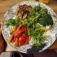 Crustini with my hand for size comparison. Much bigger portion than I expected. My favorite was the one with mushrooms on top at VegANGELov  in Belgrade