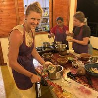 Getting the flesh out of the coconut   at Priya's Cooking School in Ella