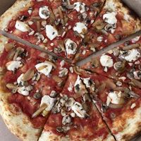 Mushrooms, grilled onions, garlic and mac nut cheeze   at Pau Pizza in Waimea