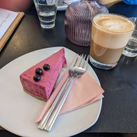Blackberry mousse cake and flat white with oat milk at Jolie Lounge & Café in Aekaeslompolo