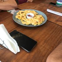 A melhor batata com cheddar e bacon   at Refúgio Veg in Rio De Janeiro