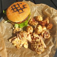 Vegan burgers with lovely baked and fried potatoes. at Stracta Bistro in Hella